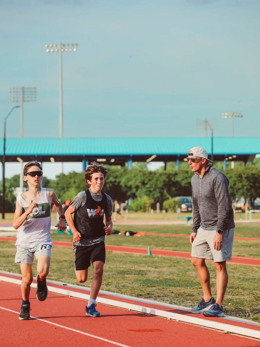 A coach running alongside two Trailblazers